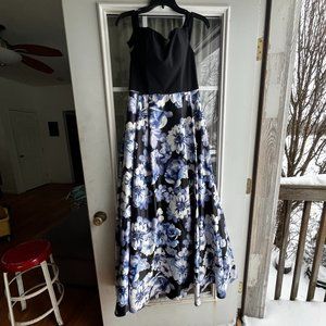 A never been worn before long blue and black dress with pockets size 5.